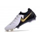 Bota Nike Phantom Luna II Elite L FG Blanco Negro Mtlc Dorado Moneda