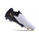 Bota Nike Phantom Luna II Elite L FG Blanco Negro Mtlc Dorado Moneda